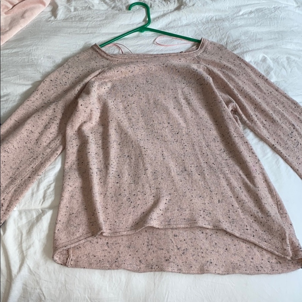Pink light sweater with slightly flared sleeves